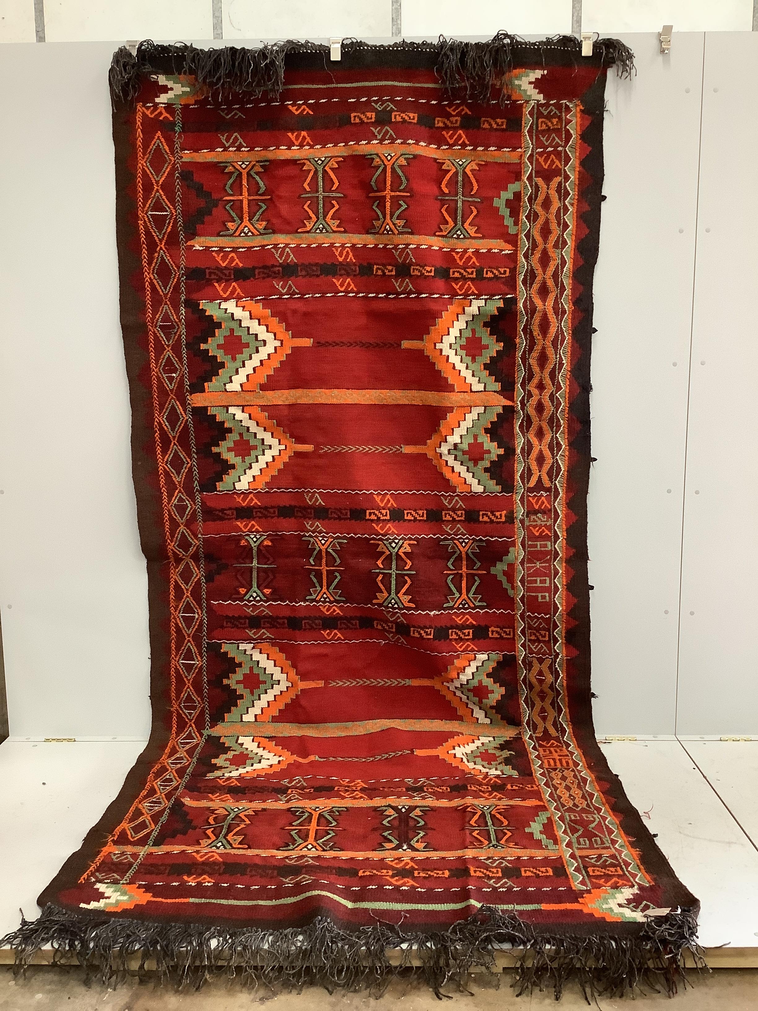 A Turkish polychrome carpet, 360 x 160cm